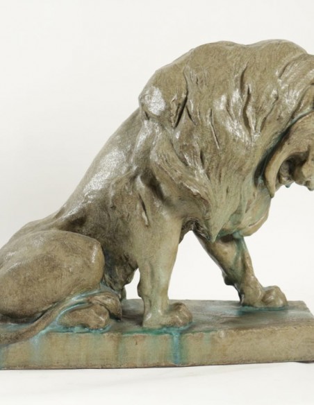 1099-Paul Jouve sculpture of a seated Lion in glazed stoneware