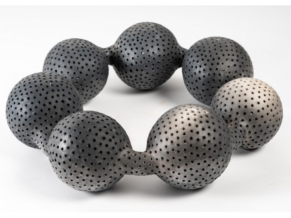 Ceramic sculpture "black pearls with holes" by Daphné Corregan - current exhibition